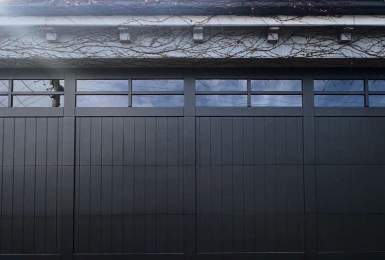 Charcoal garage door with glass top panels